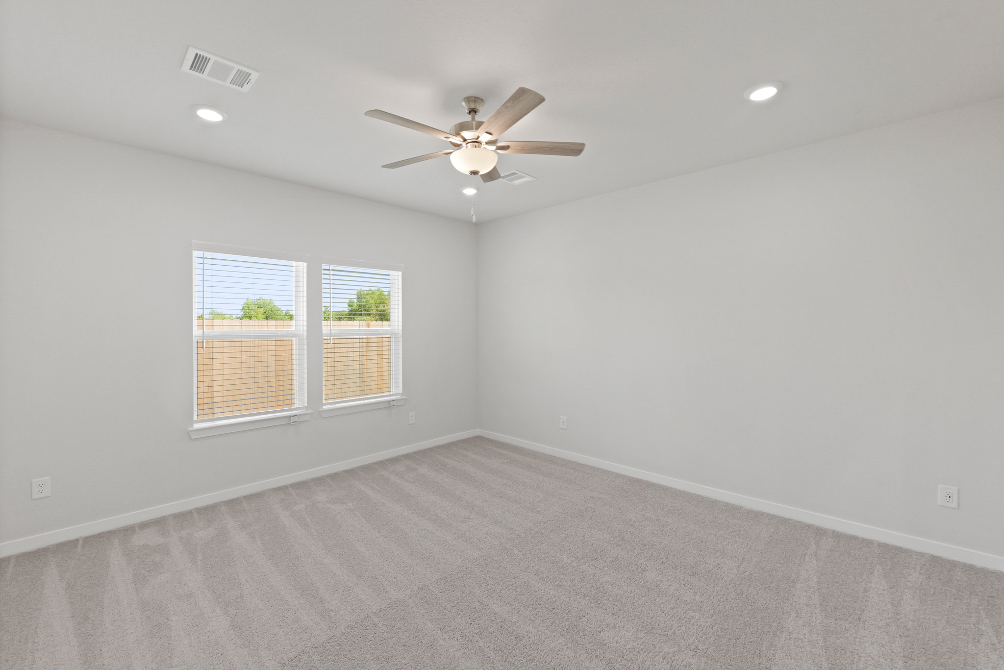 A room with a ceiling fan and a ceiling fan.