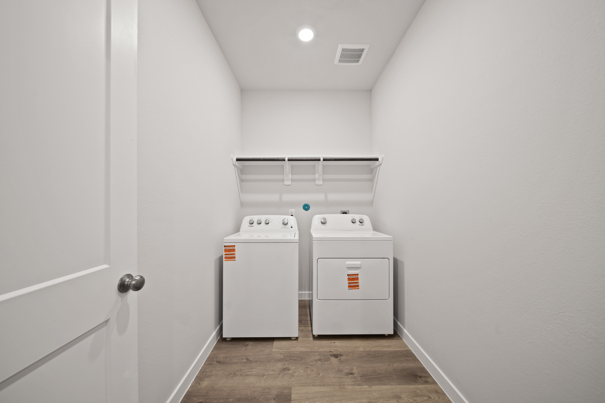 A laundry room with a washer and dryer.