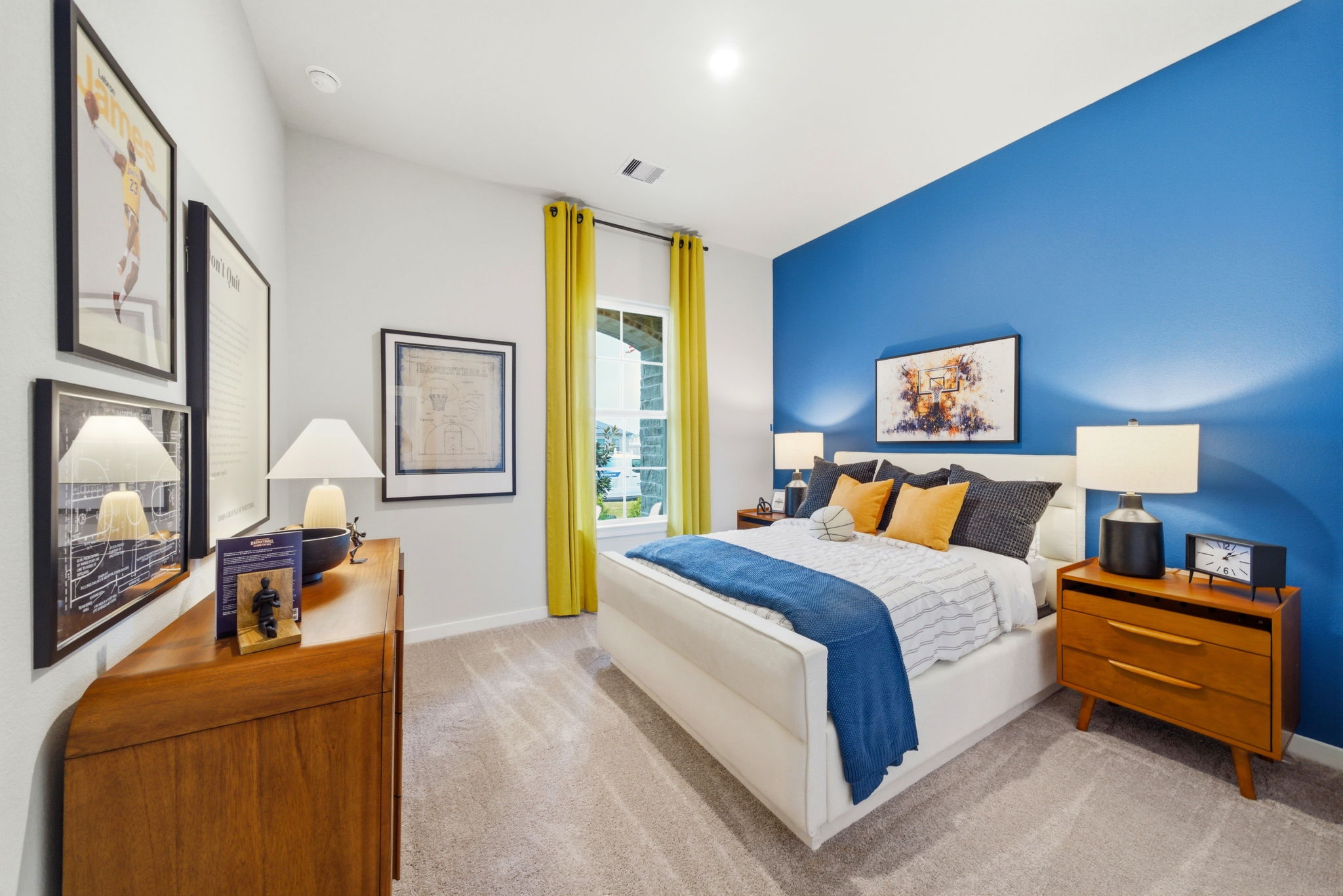 A bedroom with a bed and a dresser.