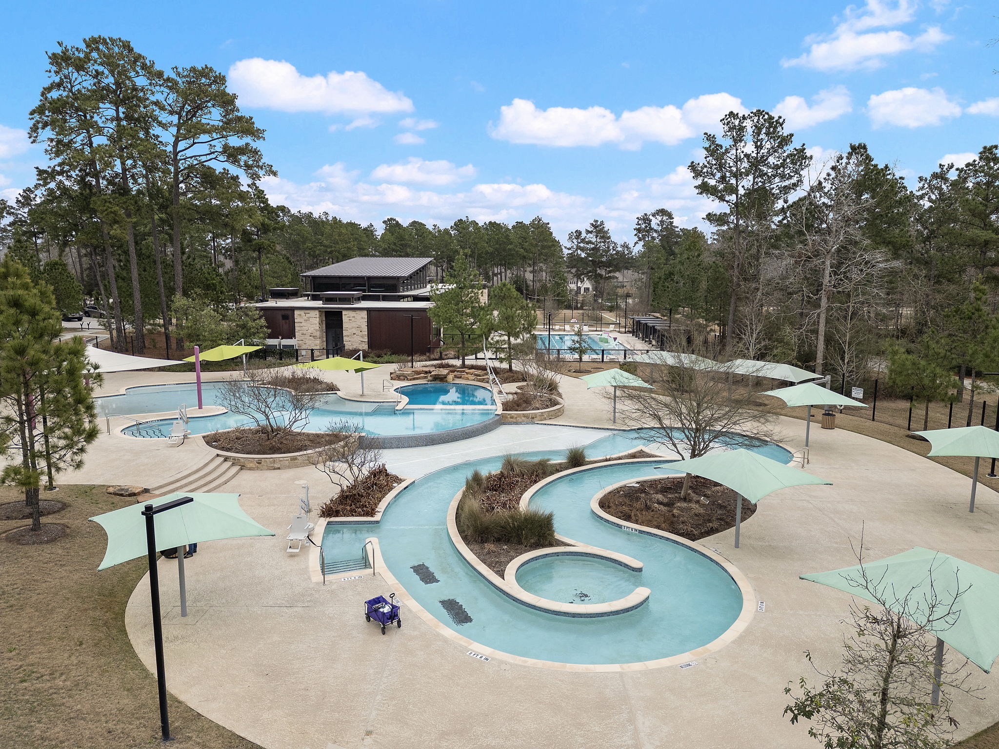 A pool with a building in the background.