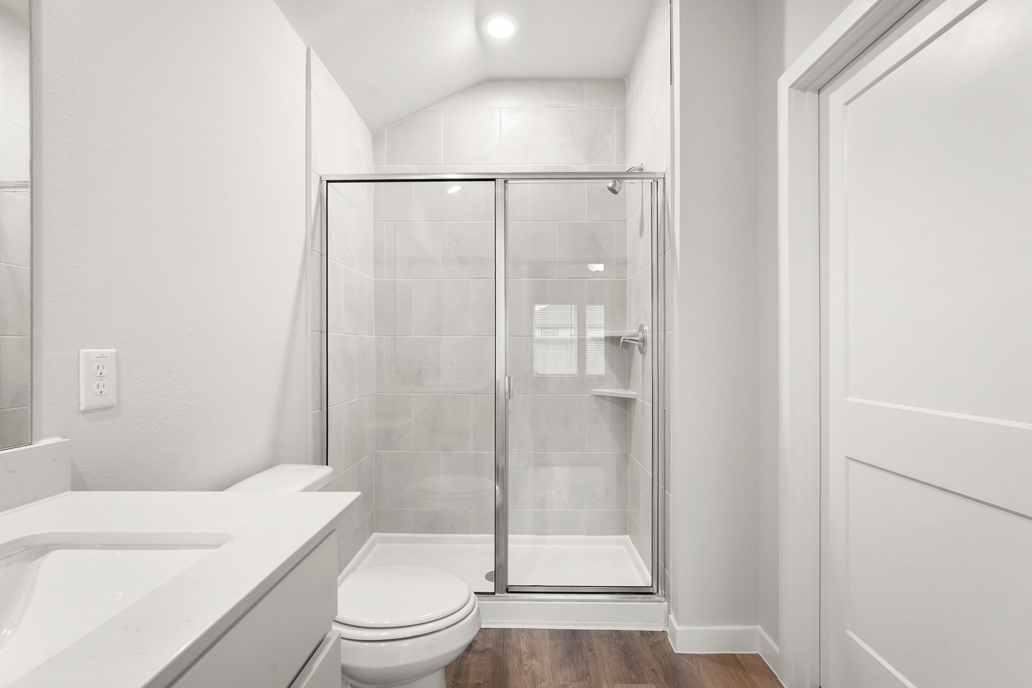 A bathroom with a glass shower.