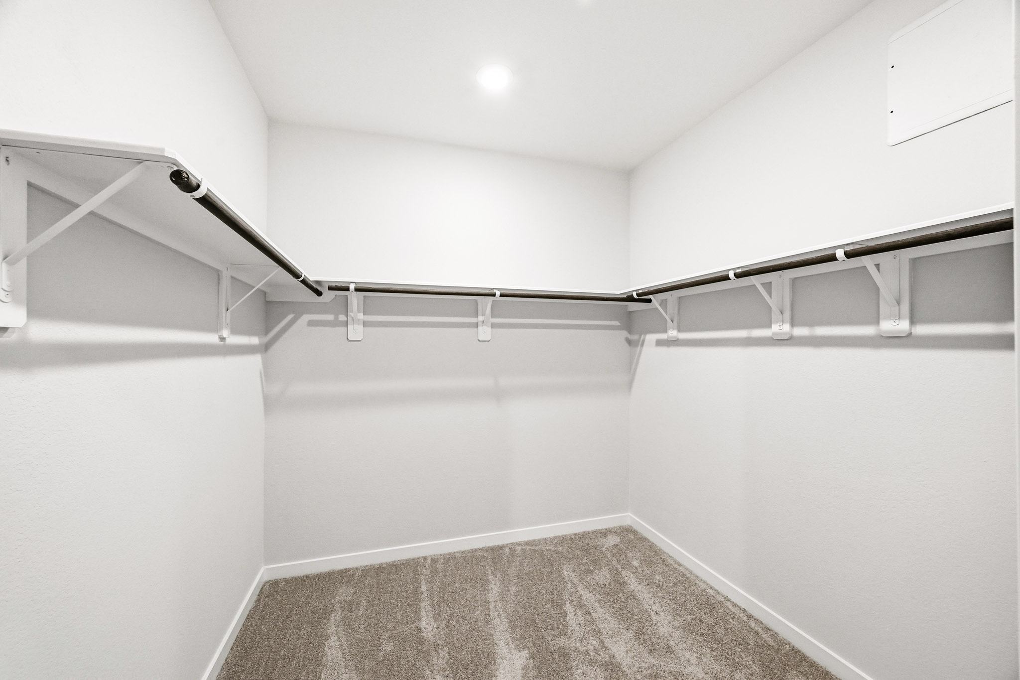 A white room with a staircase.