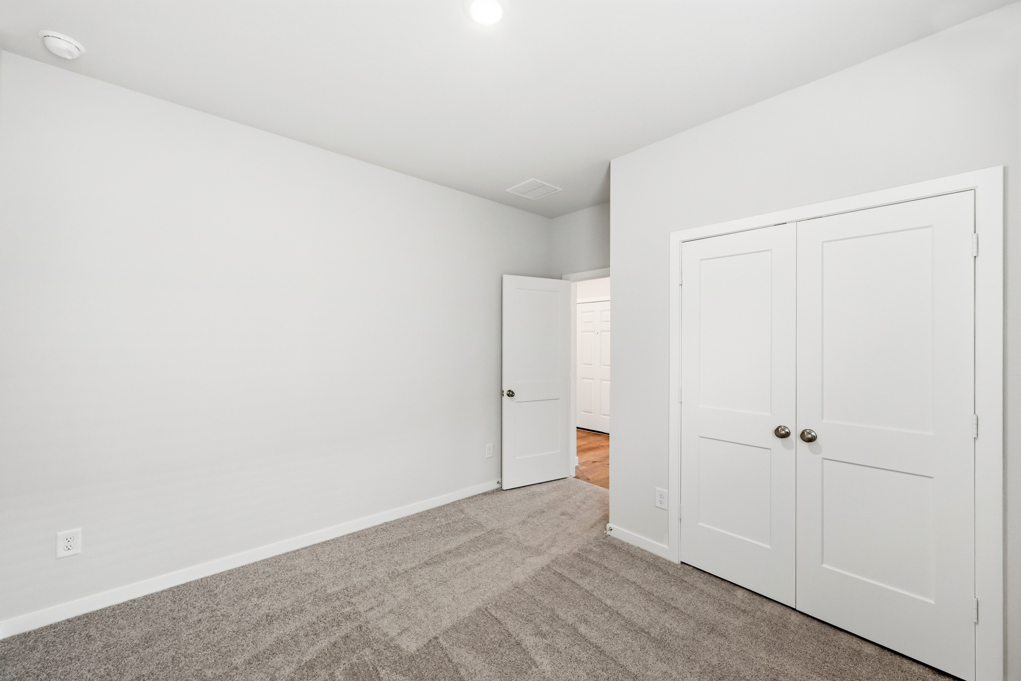A room with white doors.