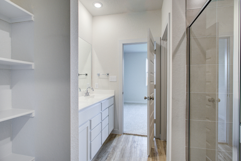 A bathroom with a glass shower.