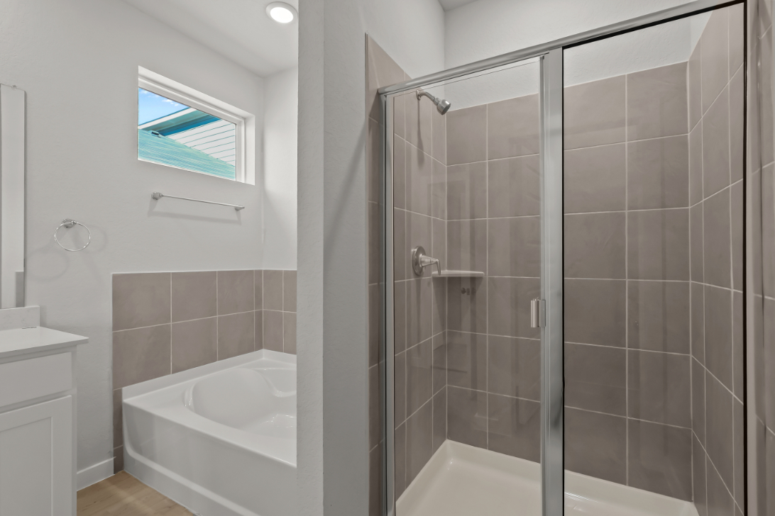 A bathroom with a glass shower.