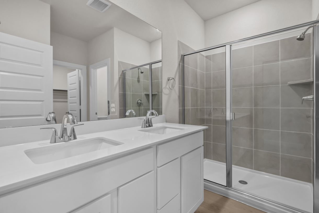 A bathroom with a glass shower.