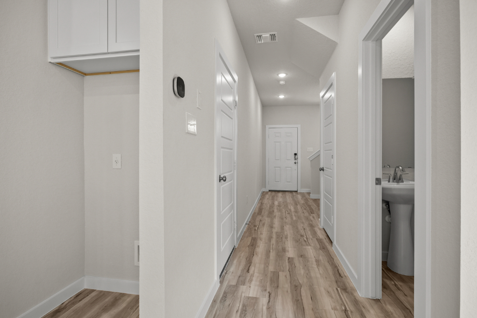 A bathroom with white walls.