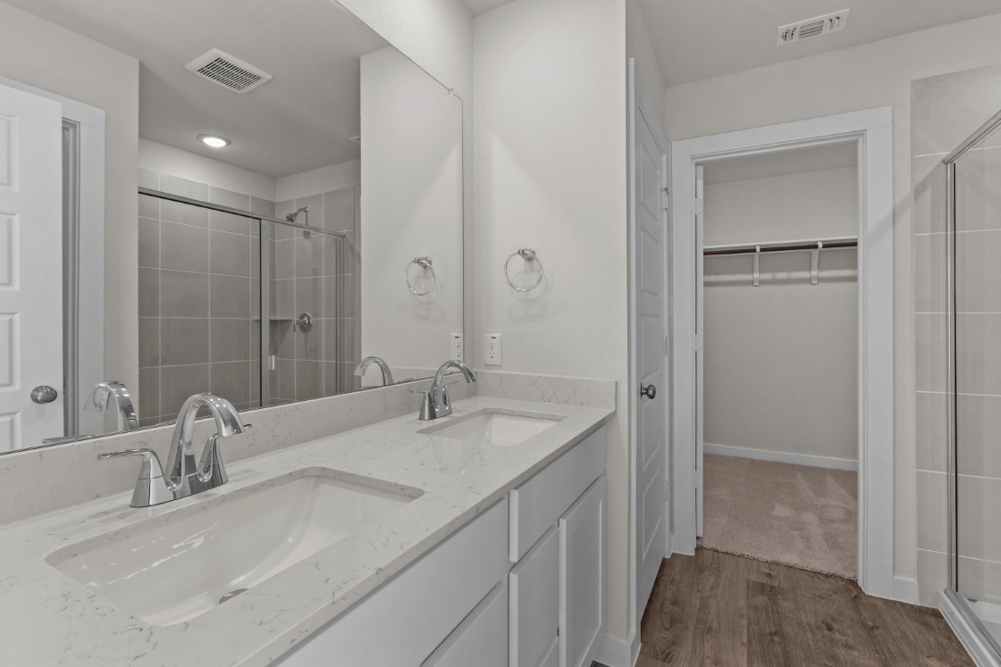 A bathroom with a glass shower.
