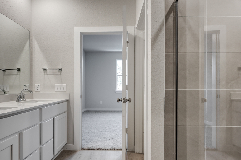 A bathroom with a glass shower.