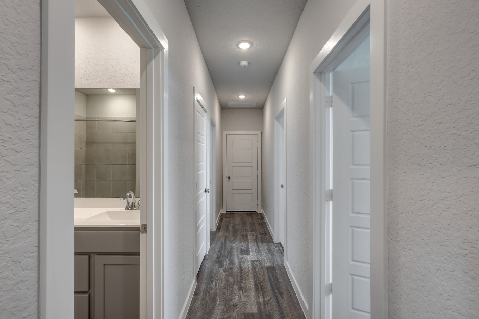 A bathroom with white walls.