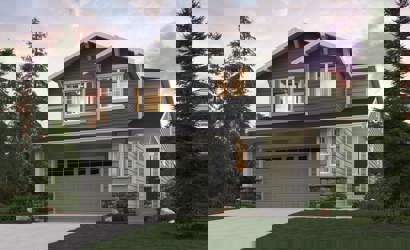 A house with a garage and trees around it.