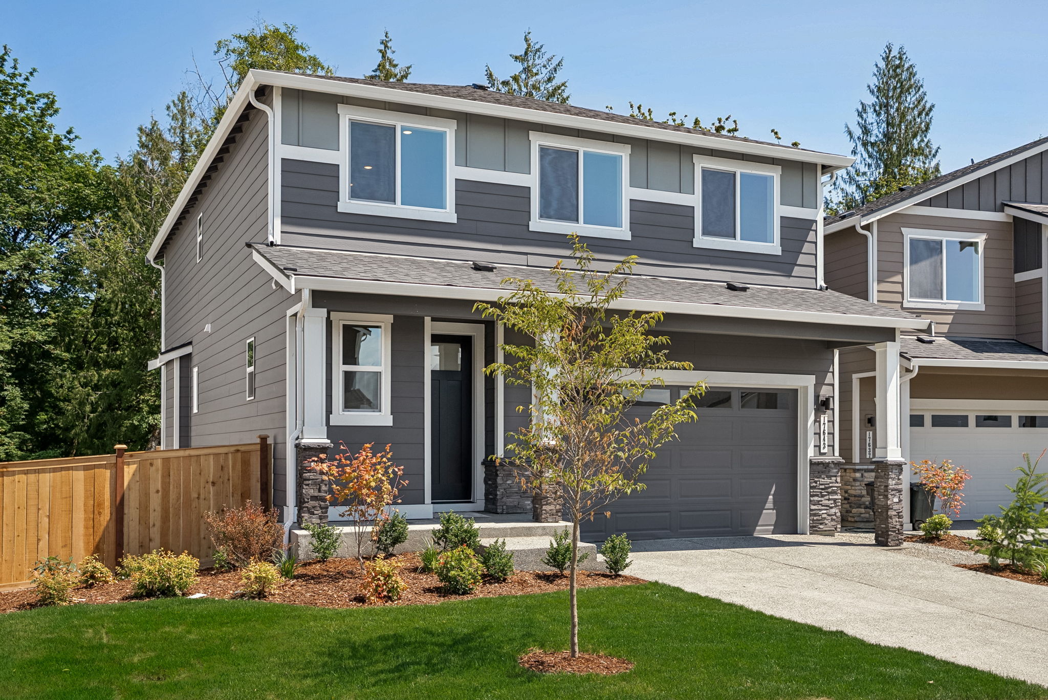 A house with a fence and trees.
