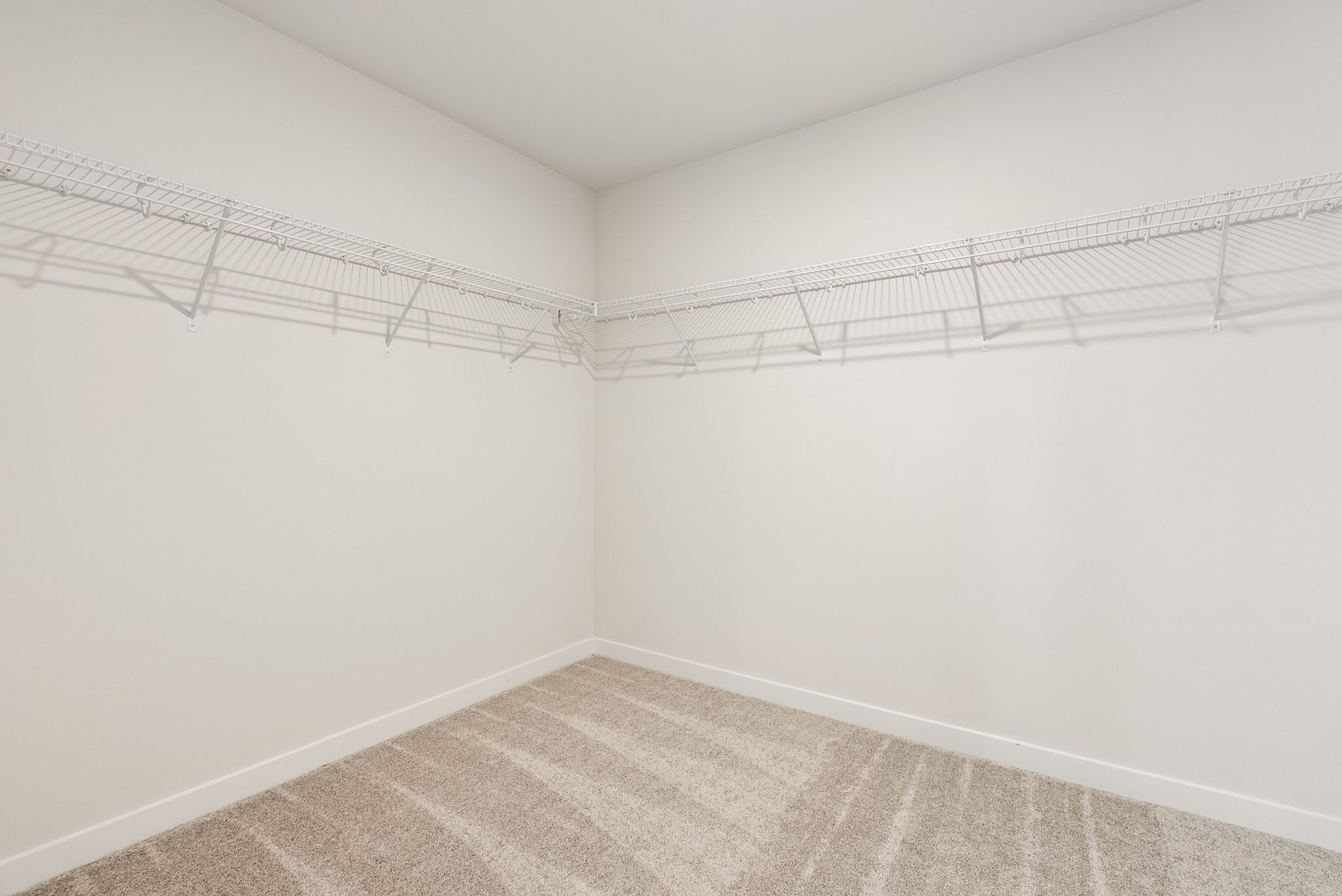 A white room with a tile floor.