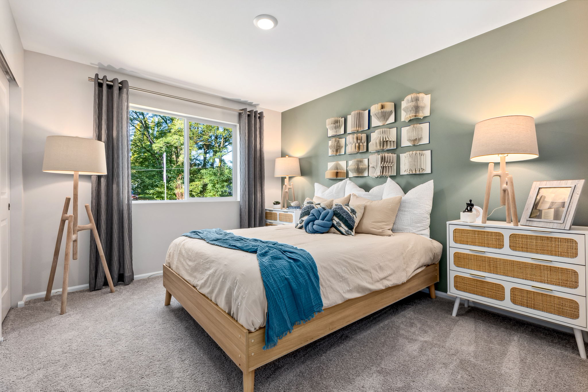 A bedroom with a bed and a window.