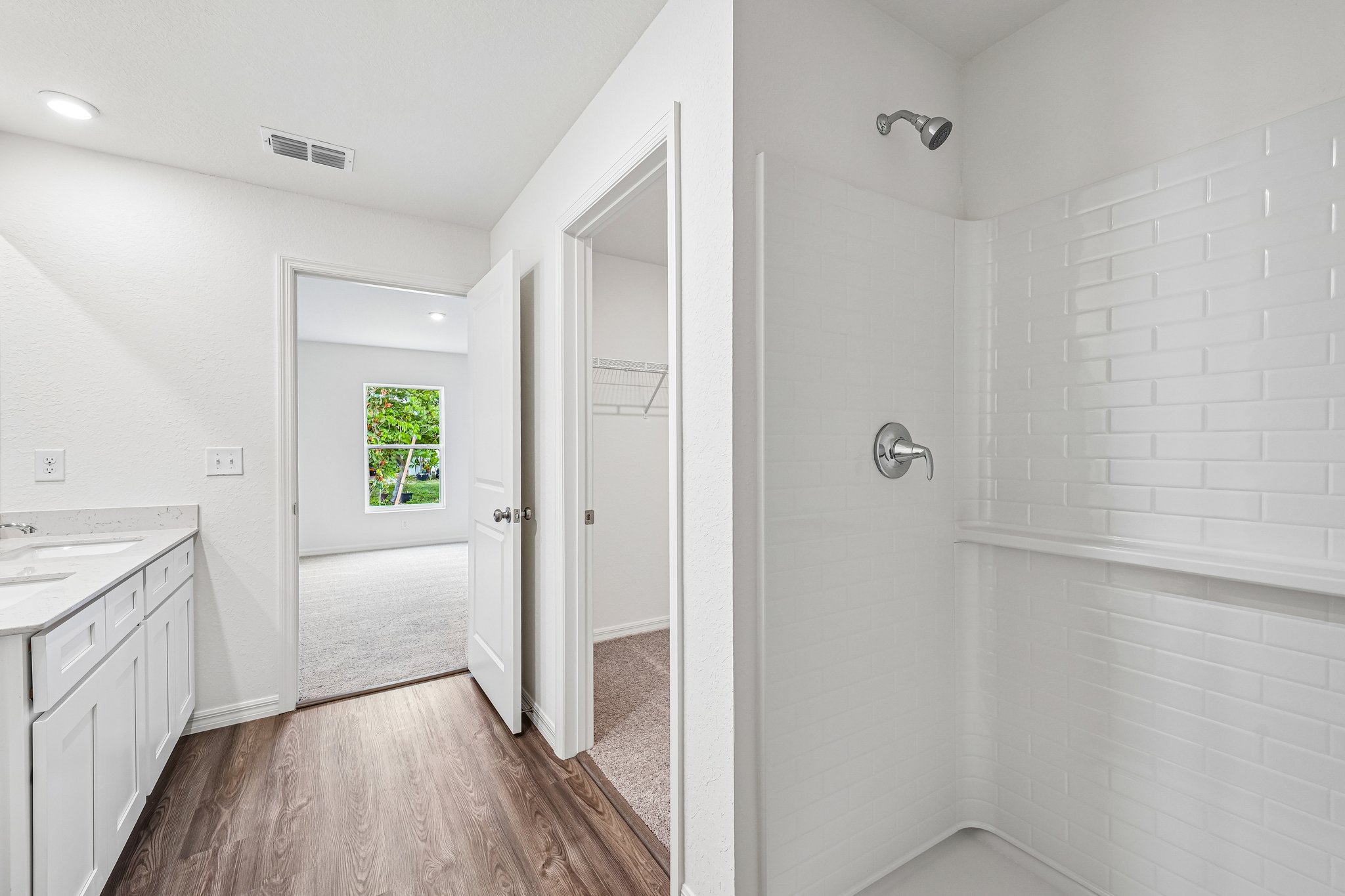A bathroom with white walls.