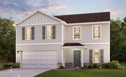 A white house with a garage.